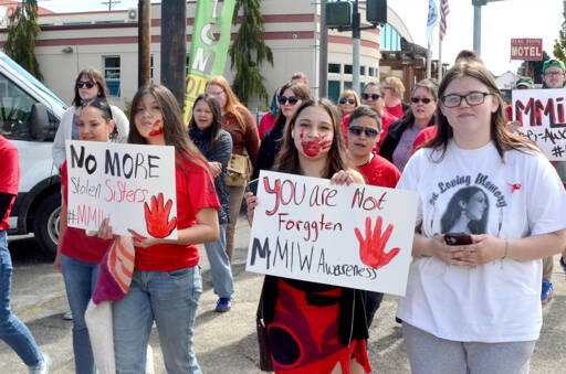 Participants in Monday’s missing and murdered indigenous people (MMIP) march wore red and walked from the Elwha Klallam Heritage Center to the Port Angeles Gateway Transit Center. (Elijah Sussman/Peninsula Daily News)