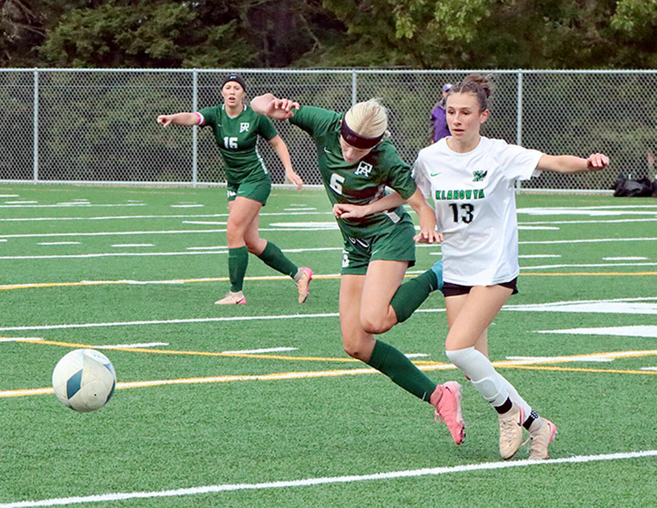 Dave Logan/for Peninsula Daily News Port Angeles’ Pyper Alton (6) battles Klahowya’s Sylvia Kemp for the ball Monday at the Monroe Playfield. In the background is Port Angeles’ Alayna Marazon (16). Port Angeles won 2-1 on a late goal by Mariah Traband.