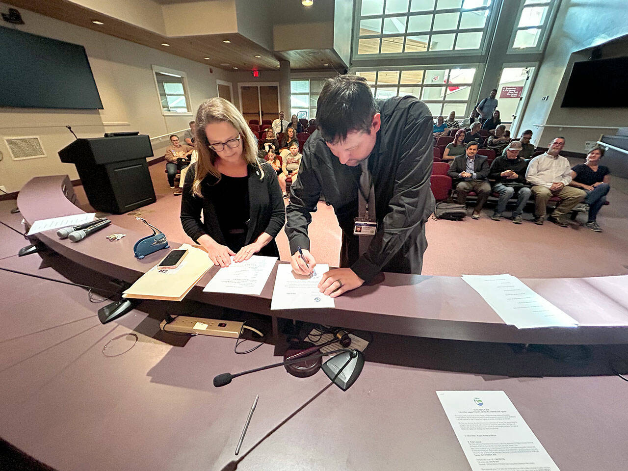 Jon Hamilton, right, is sworn in as a Port Angeles City Council member Tuesday evening in council chambers at Port Angeles City Hall. His first meeting as a council member will be Sept. 16. (City of Port Angeles)