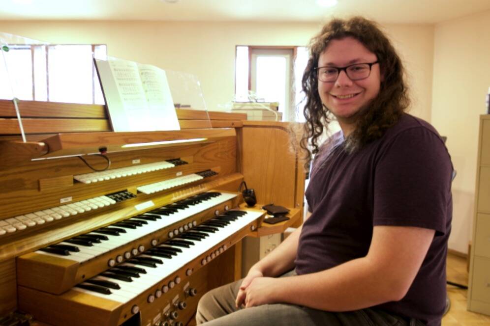 Jacques Star/Olympic Peninsula News Group
Ryan Edinger sits at the organ he now commands at Faith Lutheran Church in Sequim. There are 10 ranks of pipes, each with 61 notes, including flats and sharps.