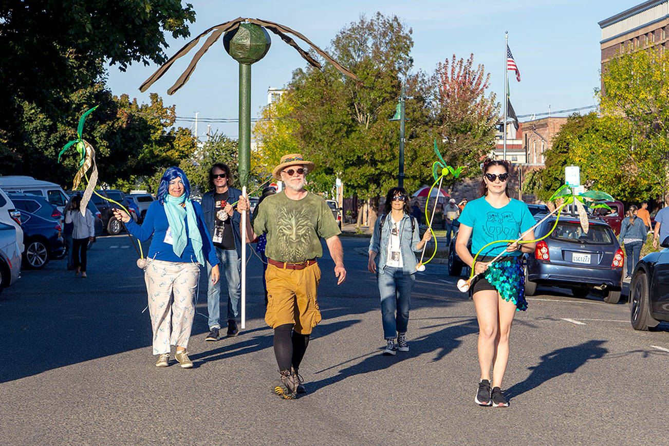 The Bull Kelp Brigade, a community group promoting awareness of ecology of the Salish Sea, marches on Washington Street during the Port Townsend Film Festival’s Filmmakers Parade on Friday. (Steve Mullensky/for Peninsula Daily News)