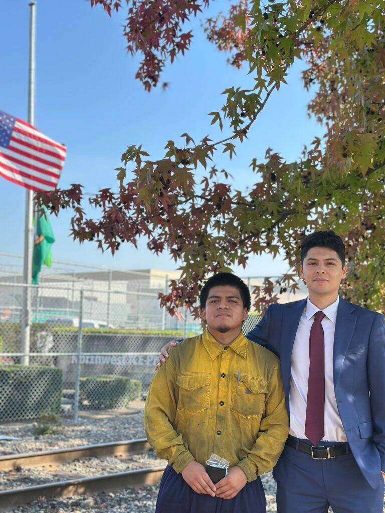 Rigoberto Hernandez Hernandez, left, stands with an attorney outside of the ICE detention center where he was held for nearly four weeks. Hernandez, a firefighter who was detained while battling a wildfire in Washington state, was released Tuesday, his attorneys said. (Courtesy photo/Innovation Law Lab)