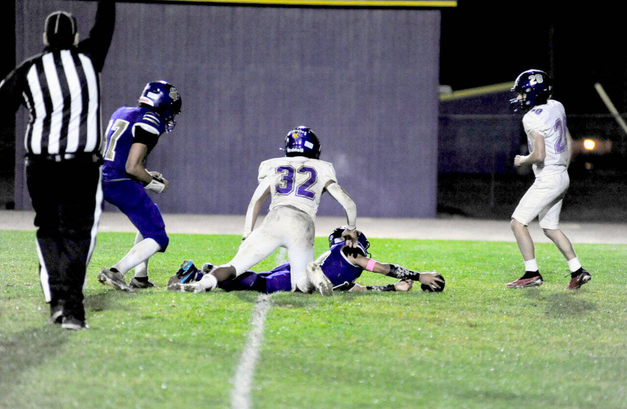 Malachi Hampton stretches for more yardage after making a 46-yard catch and run against North Kitsap late in the game Friday. The Wolves scored a touchdown on the next play. (Jacques Star/Olympic Peninsula News Group)