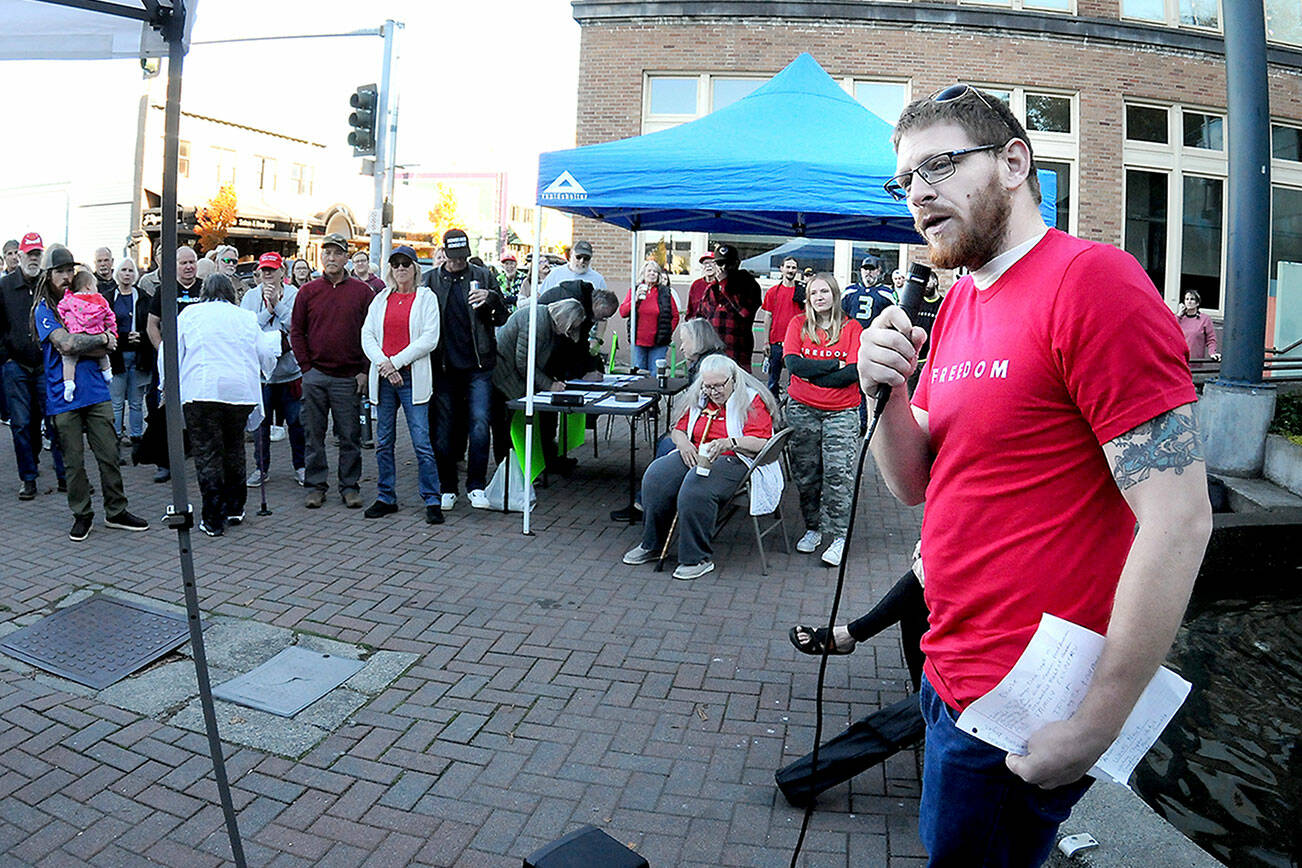 Dalton Tullis of Port Angeles speaks at a rally commemorating the life of conservative activist Charlie Kirk on Tuesday at the Conrad Dyer Memorial Fountain in downtown Port Angeles. The group hopes to develop a local chapter of the Turning Point USA student organization in honor of Kirk, who was assassinated on Sept. 10. The rally was held on the 32nd anniversary of Kirk’s birth. (Keith Thorpe/Peninsula Daily News)