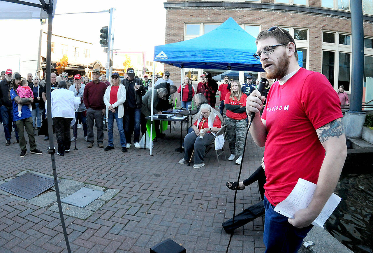 Dalton Tullis of Port Angeles speaks at a rally commemorating the life of conservative activist Charlie Kirk on Tuesday at the Conrad Dyer Memorial Fountain in downtown Port Angeles. The group hopes to develop a local chapter of the Turning Point USA student organization in honor of Kirk, who was assassinated on Sept. 10. The rally was held on the 32nd anniversary of Kirk’s birth. (Keith Thorpe/Peninsula Daily News)