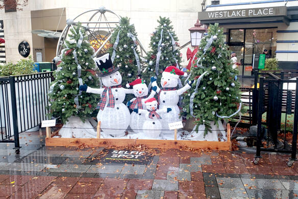 A snowman family with decorated trees is among the set pieces from Westlake Park in Seattle that will be part of the Opening Ceremonies for the Olympic Medical Center Foundation’s Festival of Trees over Thanksgiving weekend. Tickets go on sale Monday.