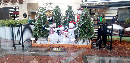 A snowman family with decorated trees is among the set pieces from Westlake Park in Seattle that will be part of the Opening Ceremonies for the Olympic Medical Center Foundation’s Festival of Trees over Thanksgiving weekend. Tickets go on sale Monday.