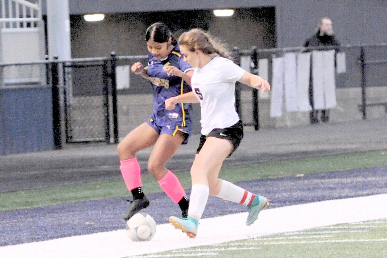 Forks' Vivi Luna competes with Ocosta's Penny Park for ball control Monday at Spartan Staidum. The game ended in a 1-1 tie. (Lonnie Archibald/for Peninsula Daily News)