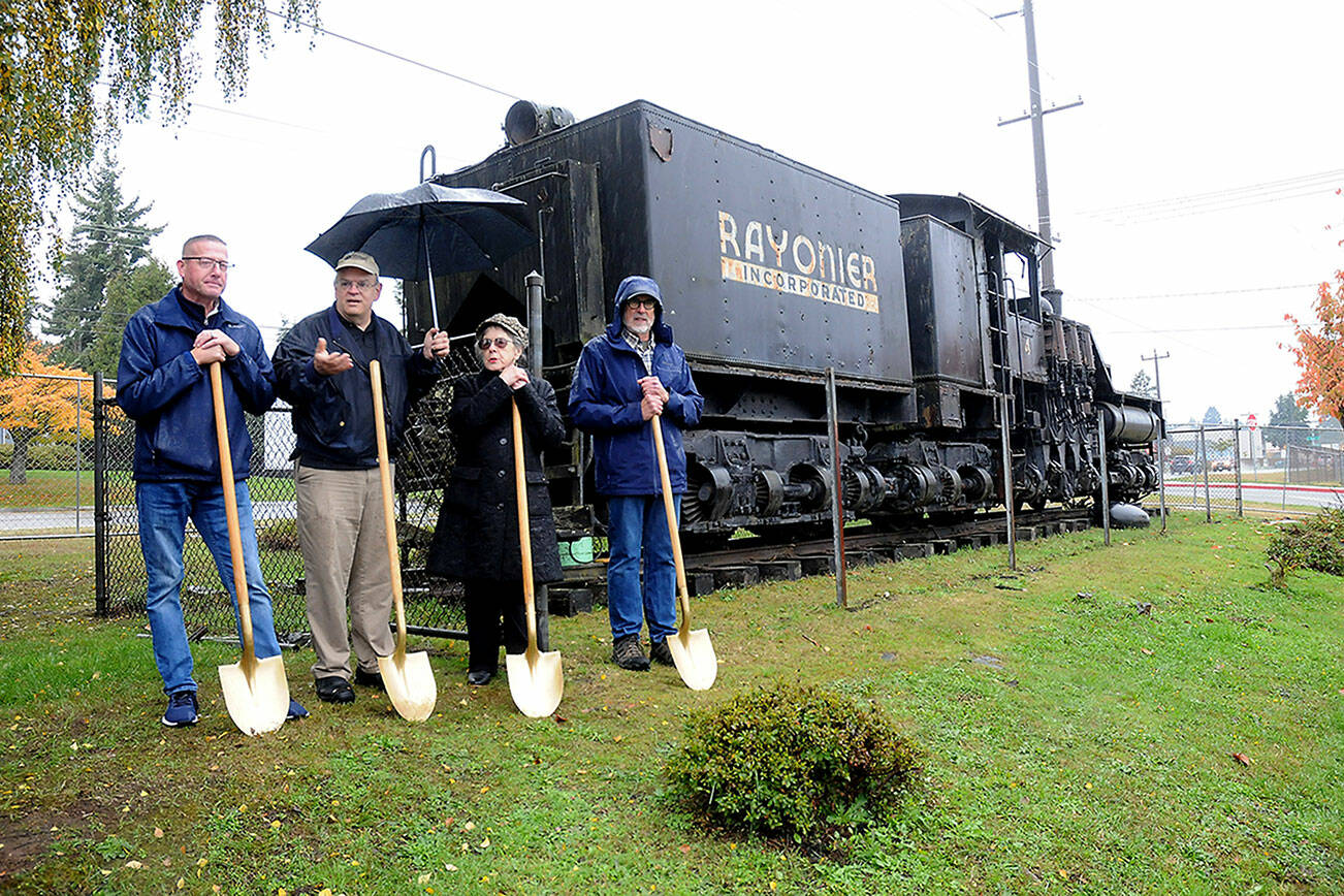 Restore the 4 officials, from left, Cory Delikat, Scott Golding, Judith Reandeau Stipe and Steve Zenovic hold ceremonial shovels during a groundbreaking ceremony for a project to renovate and restore the 1924-vintage Rayonier #4 locomotive at its display location at Chase Street and Lauridsen Boulevard in Port Angeles. The geared locomotive has been the subject of a fundraising effort to repair and repaint the engine, construct a protective cover, add a log car and create a public park at the site. (Keith Thorpe/Peninsula Daily News)
