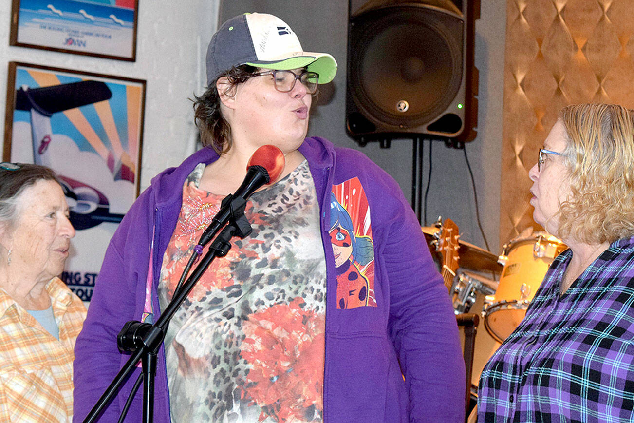 Bonny Cates, portraying Big Mama Thornton, sings during rehearsal flanked by Boneita Smith and Patty Davis.