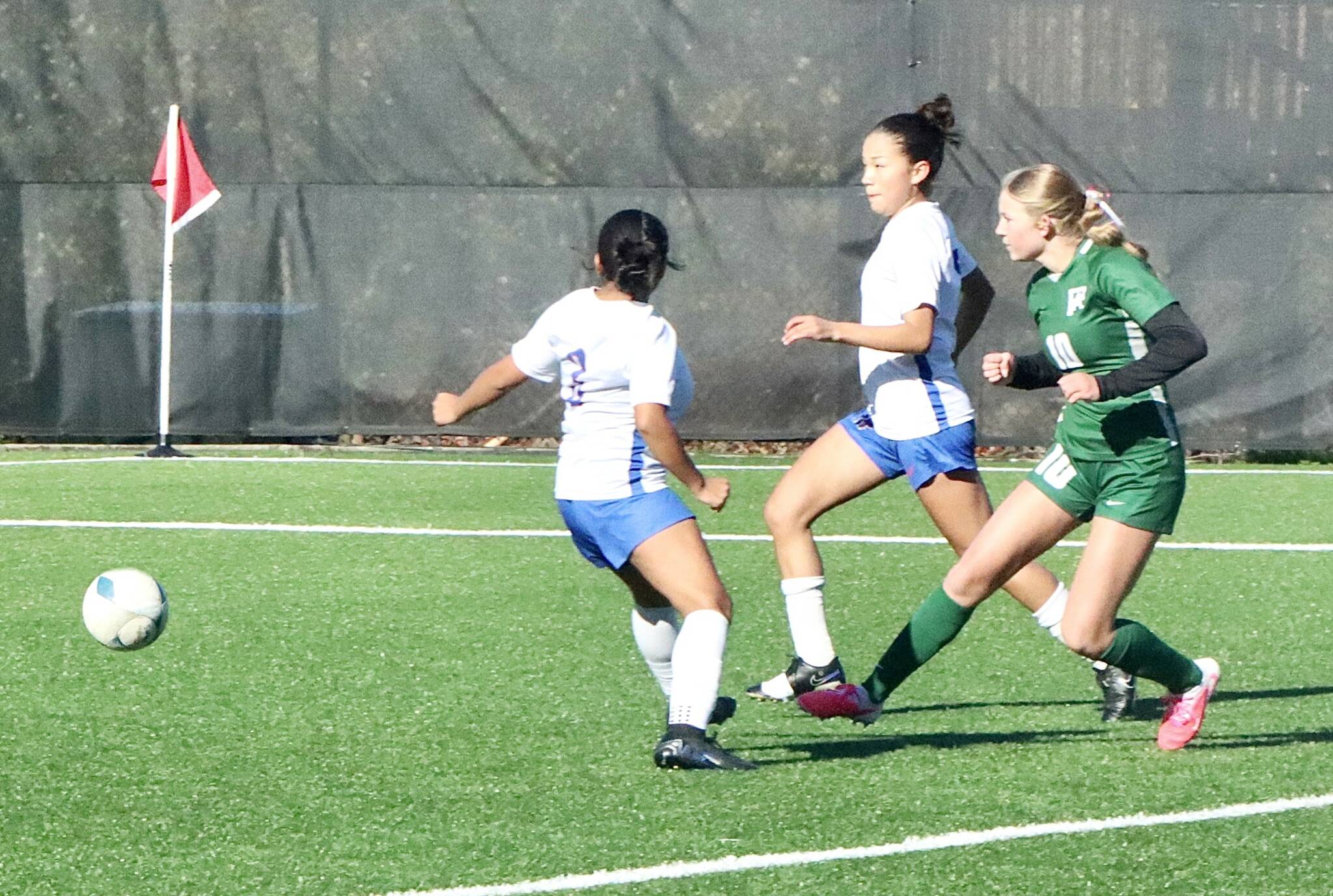Port Angeles' Lilly Anne Lancaster scores one of her three goals against Washington on Saturday at Wally Sigmar Field at Peninsula College. (Dave Logan/for Peninsula Daily News)