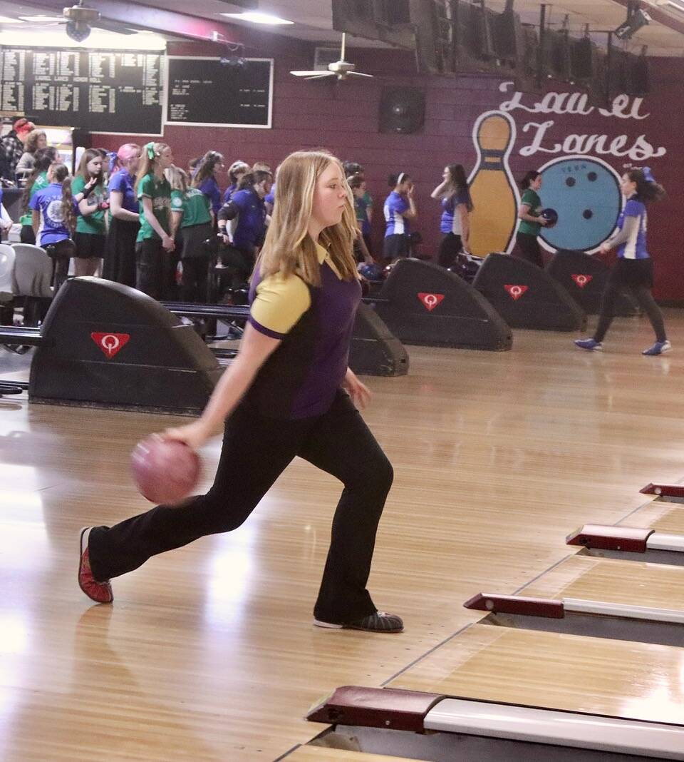 Dave Logan/for Peninsula Daily News 
Sequim’s Addy Hoffman eyes the lane as she prepares to bowl during the Wolves’ match with North Mason at Laurel Lanes in Port Angeles on Monday.