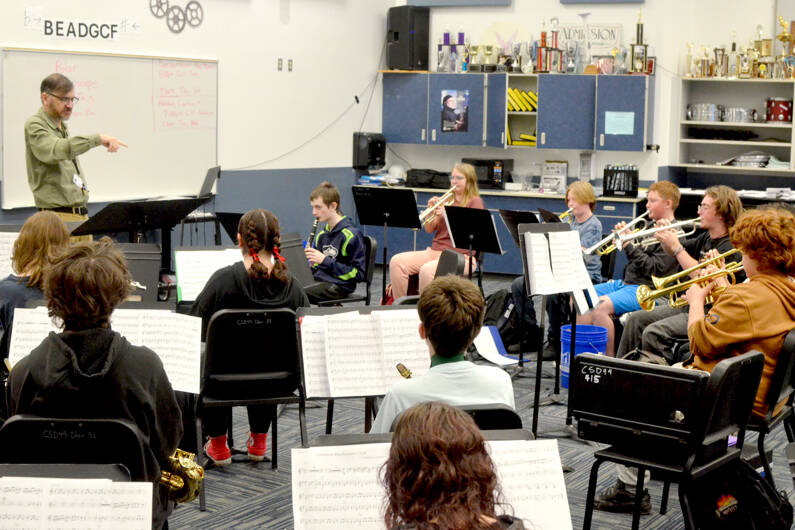 The Chimacum High School Cowboy band, which will march next July 4 in the national Independence Day Parade in Washington, D.C., rehearses holiday songs for an upcoming concert. (Elijah Sussman/Peninsula Daily News)
