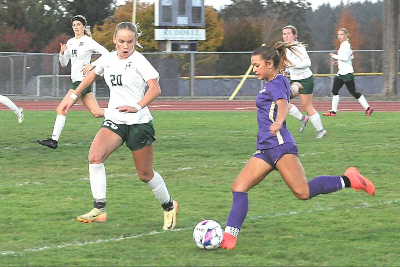 Port Angeles' Emma Desjardins, left, made the first team All-Olympic League as a freshman after scoring 21 goals for the Roughriders. Here she is defending Sequim's Ruby Moxley-Horgan, who made the league's second team. (Matthew Nash/Olympic Peninsula News Group)