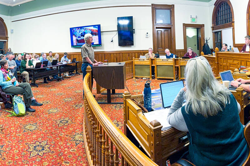 Jim Brennan, a seven-year Port Townsend resident, makes comments to a standing-room-only Port Townsend City Council meeting on Monday night. The council was continuing a public hearing on Ordinance 3361, relating to comprehensive planning that will impact the growth of the city. (Steve Mullensky/for Peninsula Daily News)