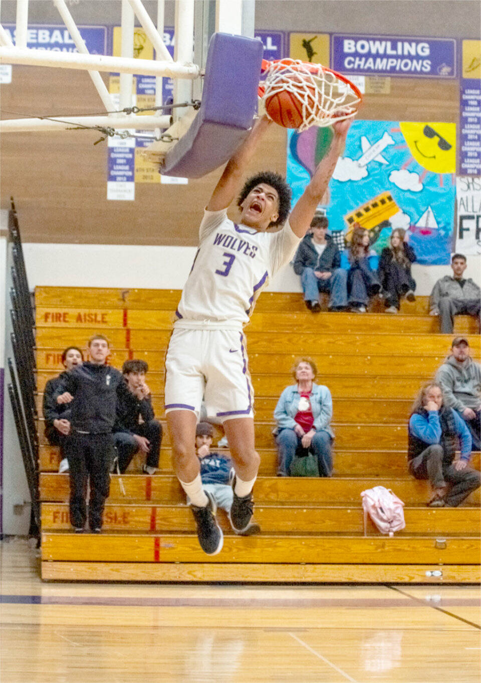 Sequim’s Solomon Sheppard dunks late in the fourth quarter against Washington in the Wolves’ 78-68 victory Saturday in Sequim. (Emily Matthiessen/for Peninsula Daily News)