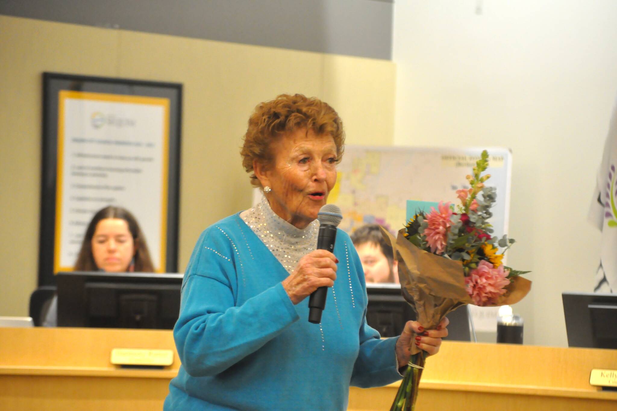 Emily Westcott shares a story in the Sequim City Council chambers on Nov. 10 about volunteering to clean up yards. She was honored with a proclamation by the council for her decades of efforts. (Matthew Nash/Olympic Peninsula News Group)