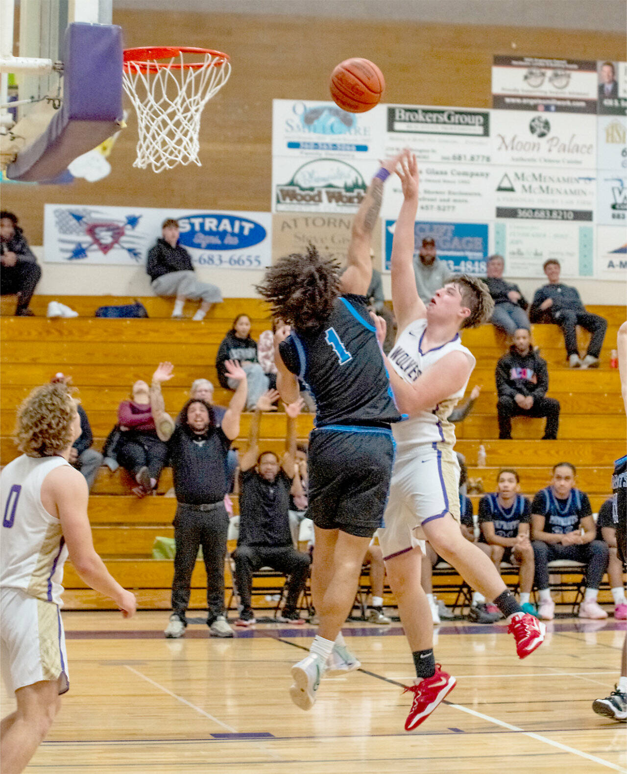 Sequim sophomore Andy Reynolds, at 6-foot-4, here shooting against Washington in Sequim on Saturday, looks to be a big contributor inside for the Wolves basketball team this season. (Emily Matthiessen/for Peninsula Daily News)